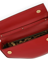 Polished calfskin moon bag with DG logo - | Dolce & Gabbana