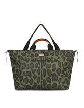 Nylon travel bag with leopard print against a green background and branded plate - | Dolce & Gabbana
