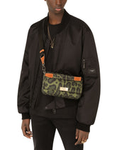 Nylon crossbody bag with leopard print against a green background and branded plate - | Dolce & Gabbana