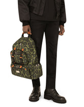 Nylon backpack with leopard print against a green background and branded plate - | Dolce & Gabbana