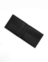 Calfskin bifold wallet with raised logo - | Dolce & Gabbana