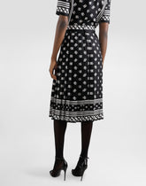 Pleated longuette skirt in silk twill with allover DG logo scarf print - | Dolce & Gabbana