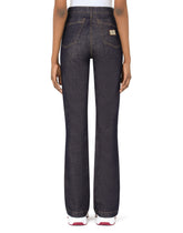 Flared jeans with tobacco-colored stitching - | Dolce & Gabbana