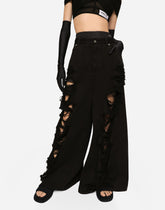 Flared jeans with ripped details - | Dolce & Gabbana