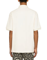 Terrycloth polo-shirt with logo tag - | Dolce & Gabbana