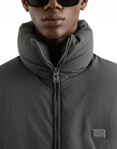 Padded technical fabric jacket with a high neck and tag - | Dolce & Gabbana