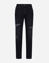 Regular blue denim jeans with abrasions and rips - | Dolce & Gabbana