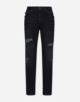 Regular blue denim jeans with abrasions and rips - | Dolce & Gabbana