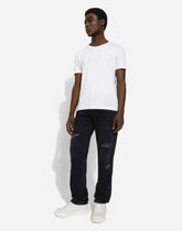 Regular blue denim jeans with abrasions and rips - | Dolce & Gabbana