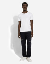 Regular blue denim jeans with abrasions and rips - | Dolce & Gabbana