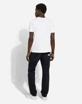 Regular blue denim jeans with abrasions and rips - | Dolce & Gabbana