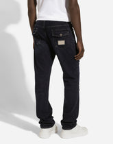 Regular blue denim jeans with abrasions and rips - | Dolce & Gabbana