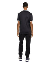 Cotton jogging pants with tag - | Dolce & Gabbana