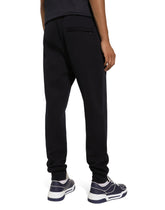 Cotton jogging pants with tag - | Dolce & Gabbana