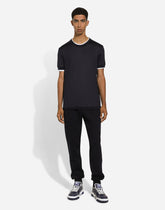 Cotton jogging pants with tag - | Dolce & Gabbana