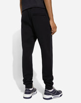 Cotton jogging pants with tag - | Dolce & Gabbana