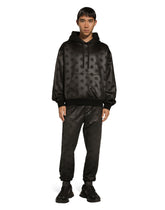 Jogging pants with embossed DG logo - | Dolce & Gabbana