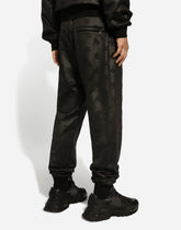 Jogging pants with embossed DG logo - | Dolce & Gabbana