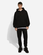 Jogging pants with rhinestone-detailed DG patch - | Dolce & Gabbana