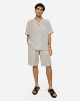 Crepe de chine jogging shorts with DG logo print - | Dolce & Gabbana