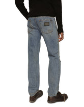 Washed denim jeans with rips - | Dolce & Gabbana