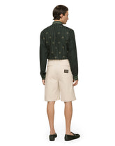 Stretch cotton Bermuda shorts with logo plaque - | Dolce & Gabbana