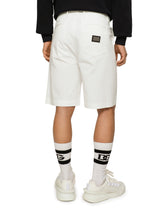 Stretch cotton Bermuda shorts with logo plaque - | Dolce & Gabbana