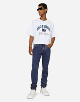Light blue slim-fit jeans with branded bands - | Dolce & Gabbana