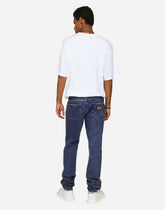 Light blue slim-fit jeans with branded bands - | Dolce & Gabbana
