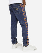 Light blue slim-fit jeans with branded bands - | Dolce & Gabbana