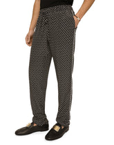 Crepe de chine jogging pants with DG logo print - | Dolce & Gabbana