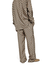 Silk jogging pants with polka-dot print and DG logo - | Dolce & Gabbana