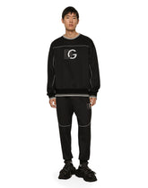 Jogging pants with embossed DG logo - | Dolce & Gabbana