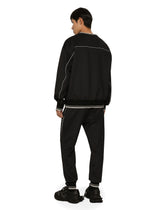 Jogging pants with embossed DG logo - | Dolce & Gabbana