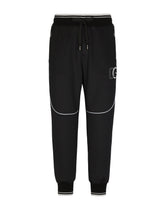 Jogging pants with embossed DG logo - | Dolce & Gabbana