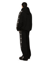 Jogging pants with branded side bands - | Dolce & Gabbana