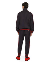 Pinstripe jogging pants with branded bands - | Dolce & Gabbana