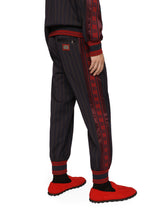 Pinstripe jogging pants with branded bands - | Dolce & Gabbana