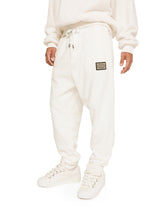 Terrycloth jogging pants with logo tag - | Dolce & Gabbana