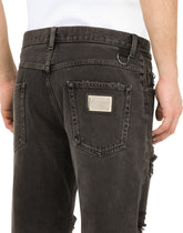 Loose light gray jeans with repaired rips - | Dolce & Gabbana