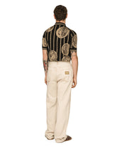 Overdyed jeans with raw hem details - | Dolce & Gabbana