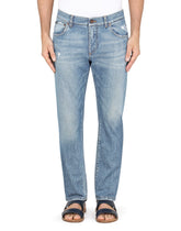 Light blue slim-fit stretch jeans with micro-rips - | Dolce & Gabbana
