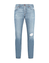 Light blue slim-fit stretch jeans with micro-rips - | Dolce & Gabbana