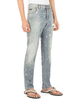 Slim-fit blue wash stretch jeans with abrasions - | Dolce & Gabbana