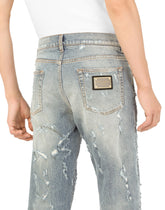 Slim-fit blue wash stretch jeans with abrasions - | Dolce & Gabbana