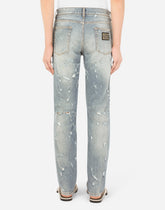 Slim-fit blue wash stretch jeans with abrasions - | Dolce & Gabbana
