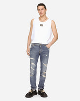 Mid blue slim-fit stretch jeans with rips - | Dolce & Gabbana