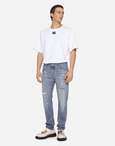 Light blue slim-fit stretch jeans with rips - | Dolce & Gabbana
