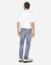 Light blue slim-fit stretch jeans with rips - | Dolce & Gabbana