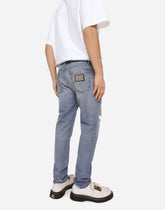 Light blue slim-fit stretch jeans with rips - | Dolce & Gabbana